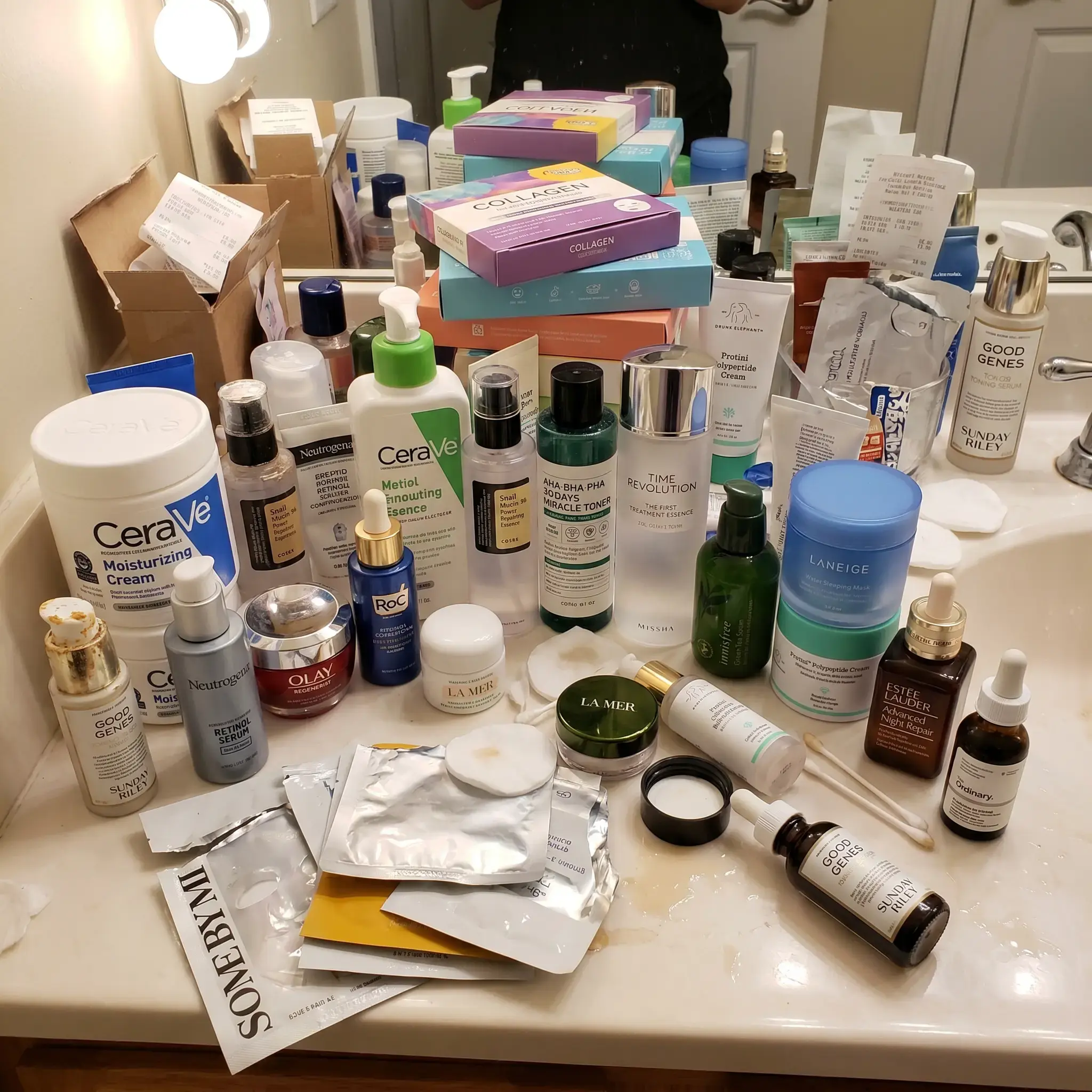 The counter I'd built going harder: dozens of serums, creams, and masks, most of them half-used